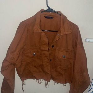 Women’s cropped denim jacket. Size large. Color brownish tan